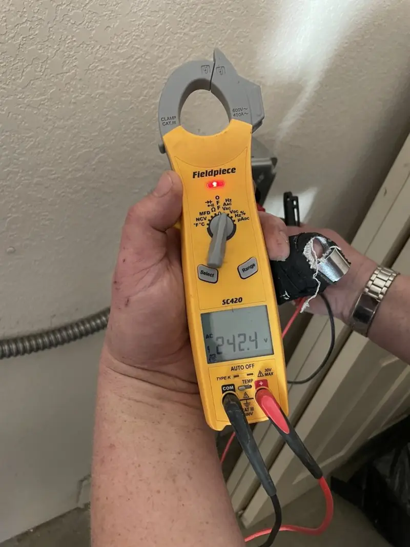 Voltage testing with clamp meter during Ceiling Fan Installation in Beloit